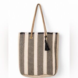 Black & cream woven straw tote bag with bold striped pattern